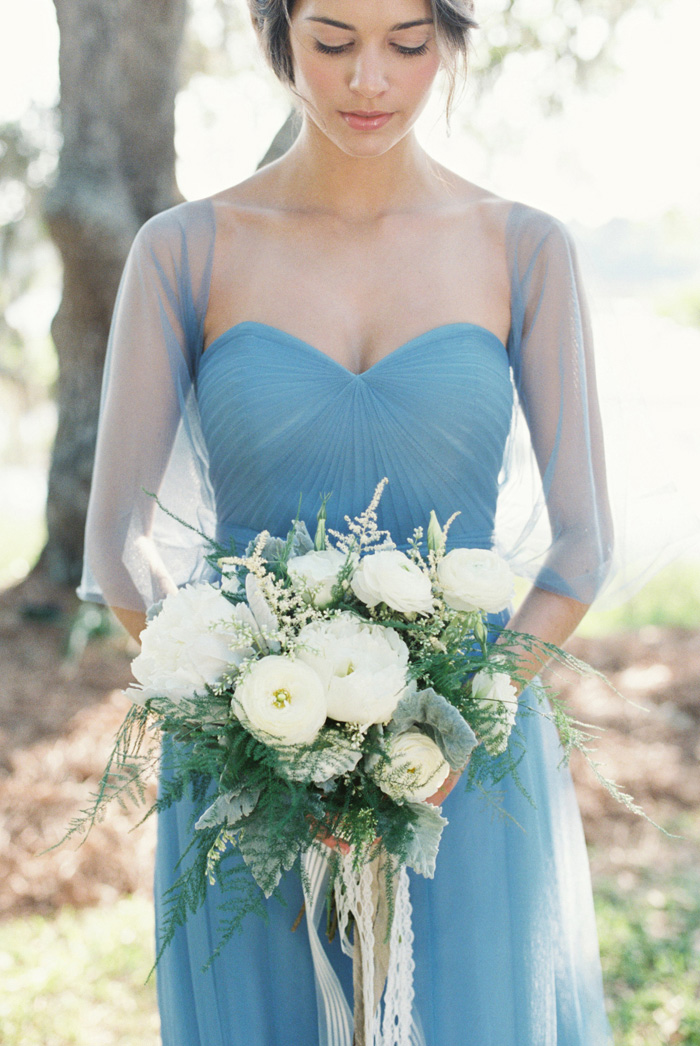 blue wedding ideas -bridesmaid in blue tulle dress with white bouquet