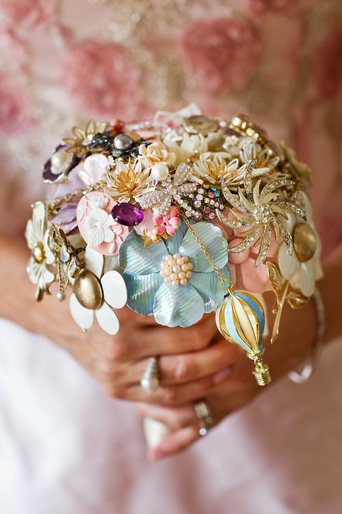 brooch bouquet with hidden charms of dragonflies and a hot air balloon