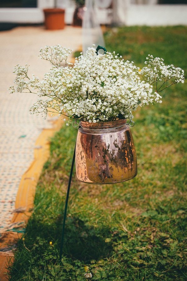 Copper kettle filled with gypsophila