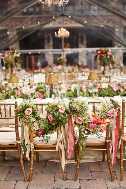 Floral covered bride and groom chairs