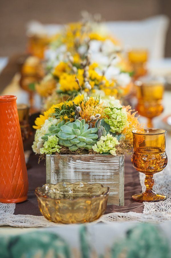 fall wedding centerpiece using succulents and amber glass