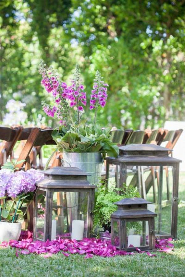 rustic purple flowers and lanterns wedding decor