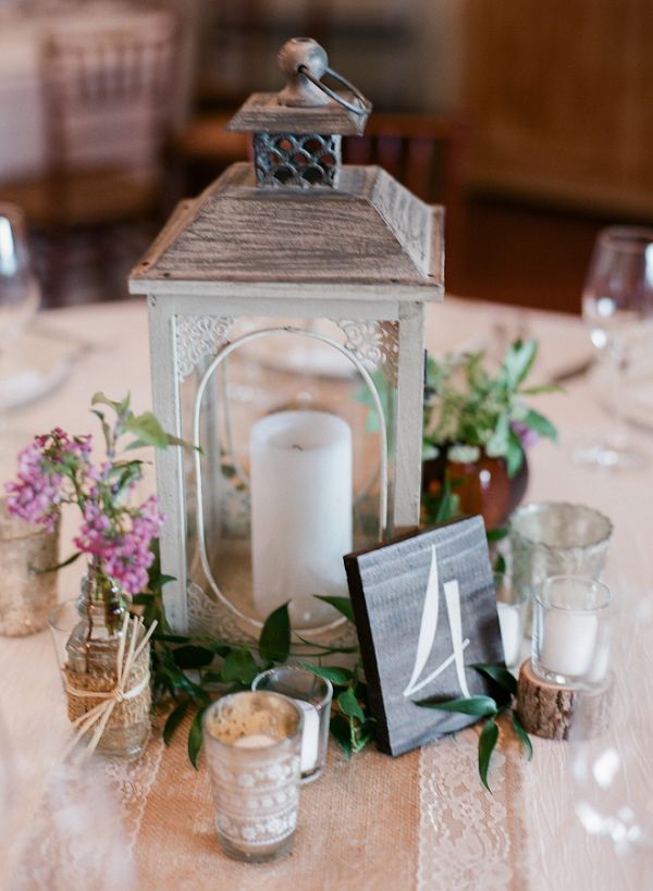 rustic wedding reception lantern and table number wedding centerpiece