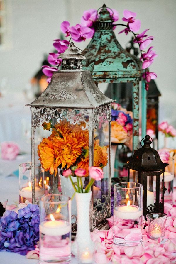 vintage lanterns and blooms wedding centerpiece