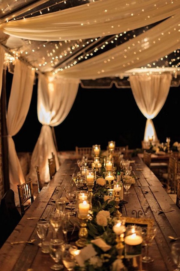 Rustic night wedding tent reception under the stars
