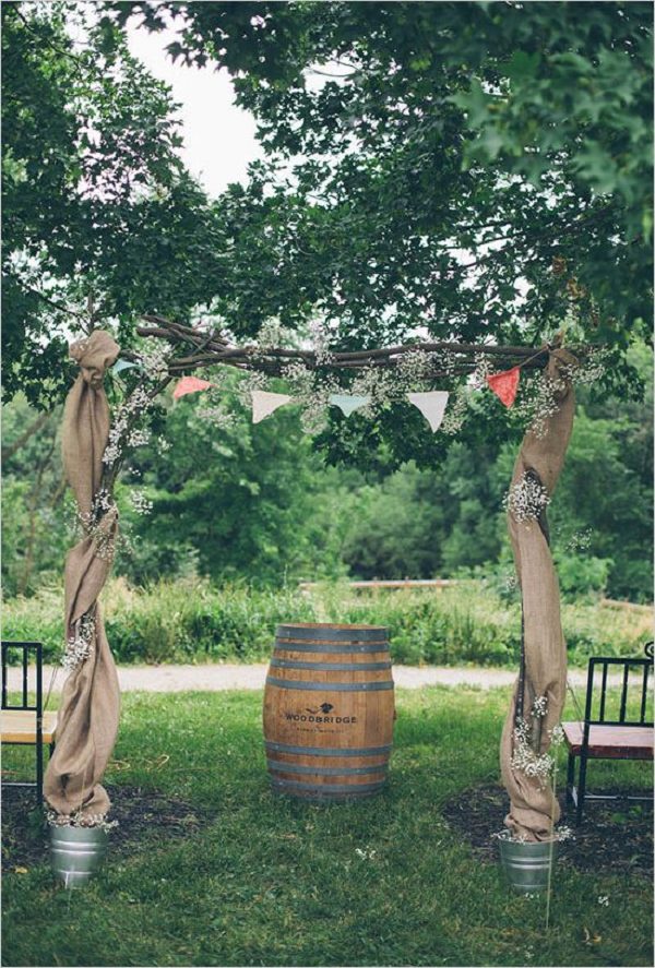 Wedding ceremony arch with bunting and burlap