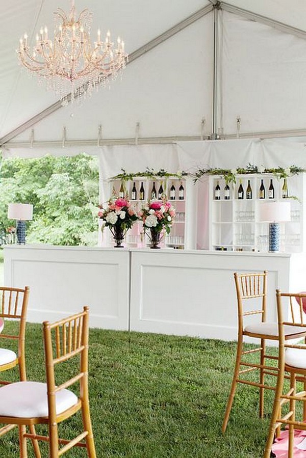 White wooden bar with crystal chandelier