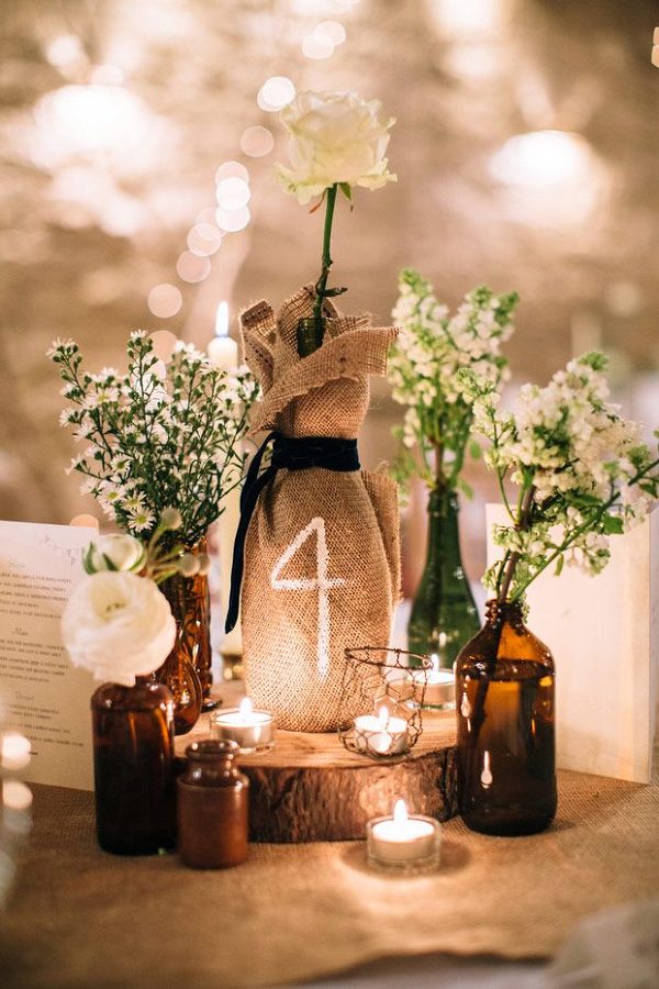 wine bottle and burlap table numbers and rustic wedding decor