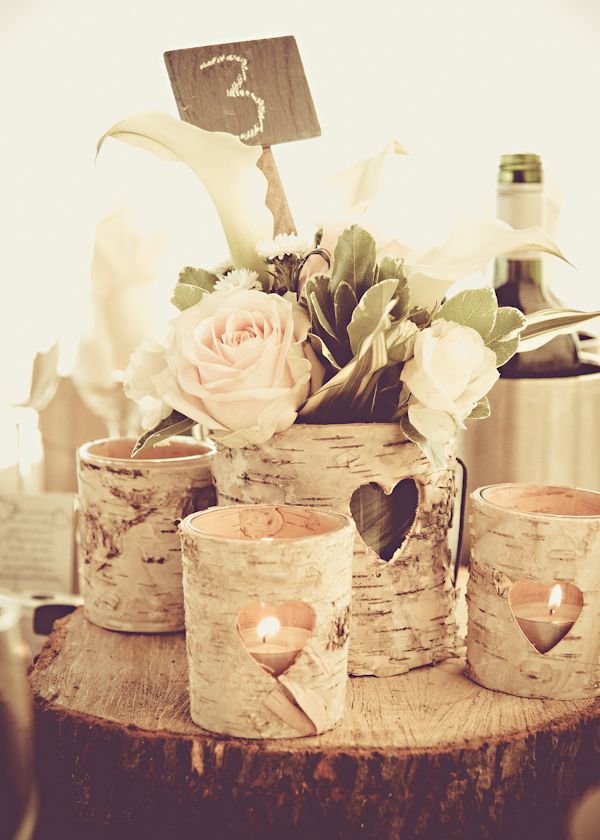 Centerpiece idea, old tin cans painted sitting on birch slice, flowers and birch branches