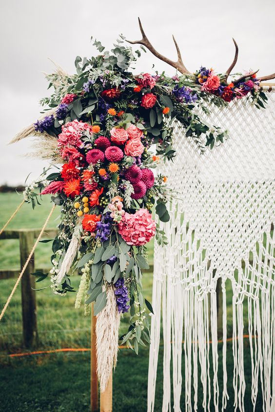 Colourful Boho macrame wedding arch backdrop