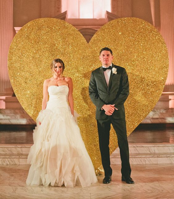 Giant gold glitter heart wedding backdrop