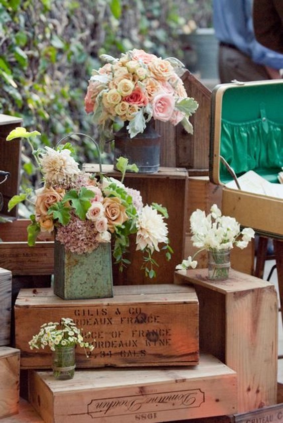 Lovely Flowers in Rustic Containers on Wood Crates