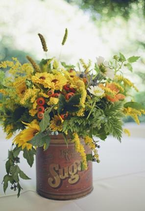 Old tin sugar can as a rustic vase