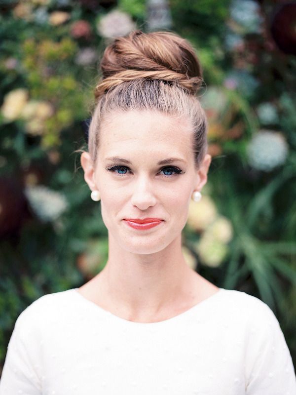 Sleek and twisted topknot wedding hairstyle