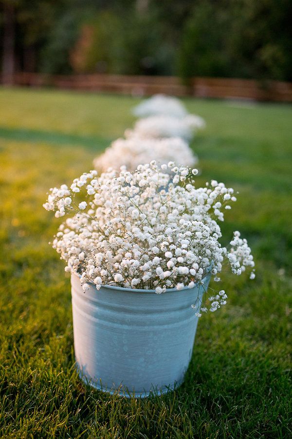 45+ Charming Inexpensive Country Tin Can Wedding Ideas 40 Wedding Aisle Wedding Decor idea- baby's breath in tin cans