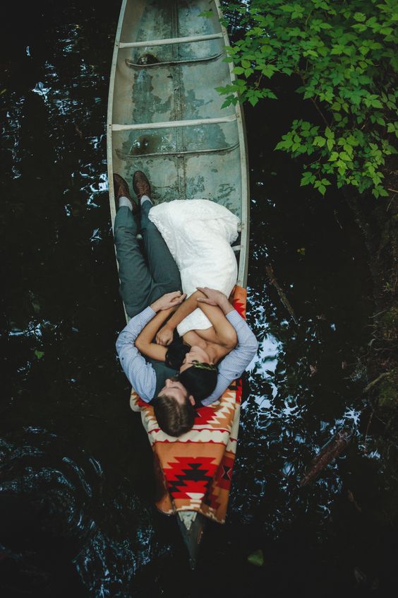 couple in canoe wedding photo ideas