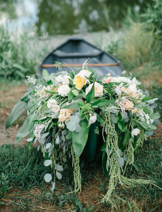 lakeside canoe wedding flowers decor