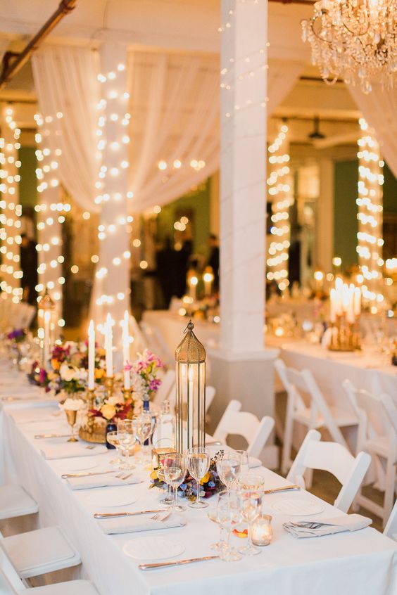 long white tables with clusters of eclectic decor & candles