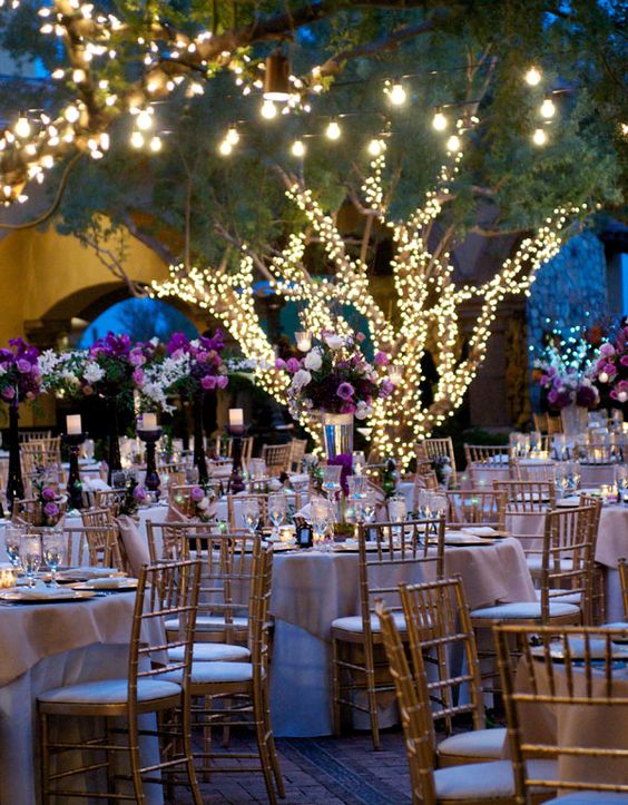 outdoor wedding table setting with lights