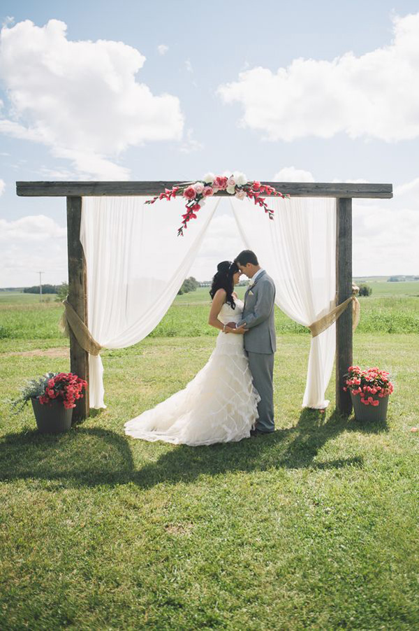 pink and gray outdoor familly farm wedding ceremony arch