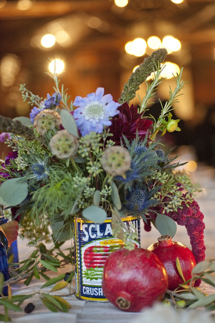 rustic tomato cans, herbs, pomegranates and flowers