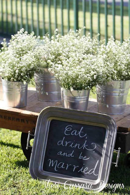 rustic wedding decor ideas- baby's breath in tin cans