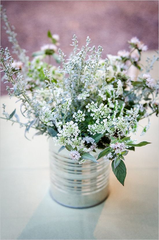 simple rustic wild flowers in tin can centerpiece