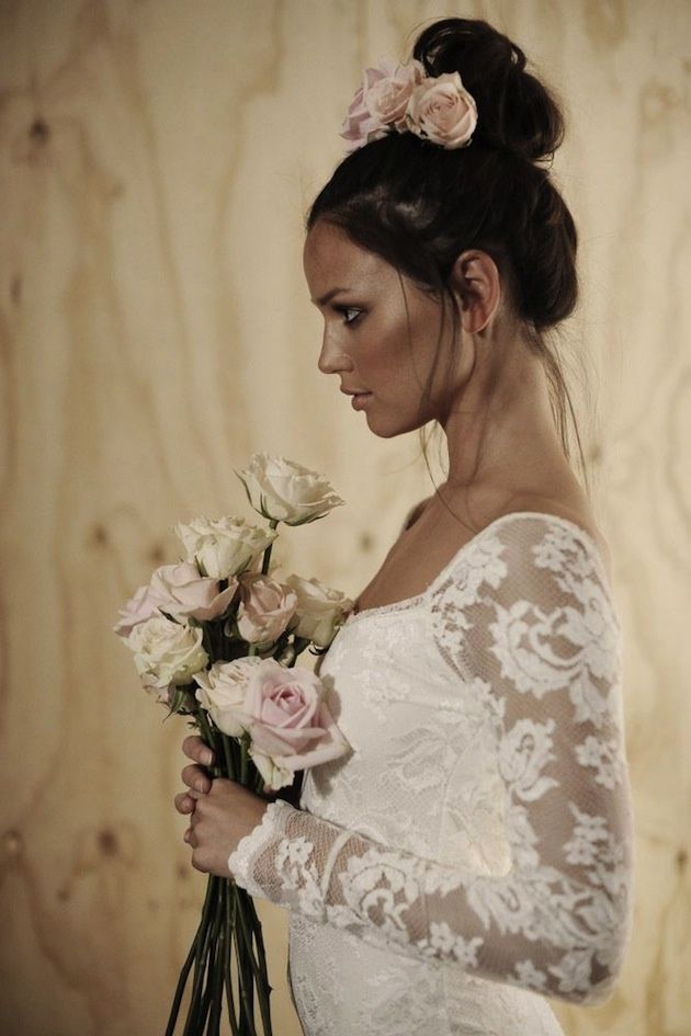 topknot bun wedding hairstyle with roses