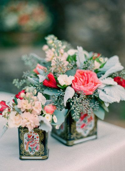 vintage flowers in chinese tea tins wedding centerpiece