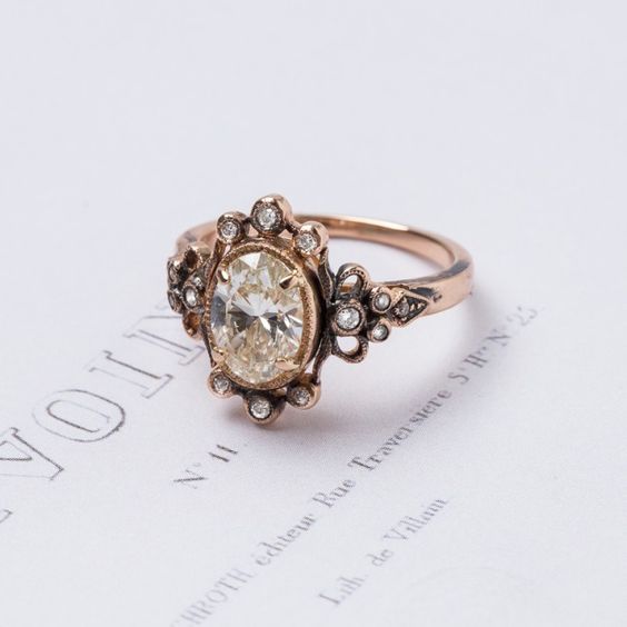 vintage-inspired diamond engagement ring set in oxidized rose gold