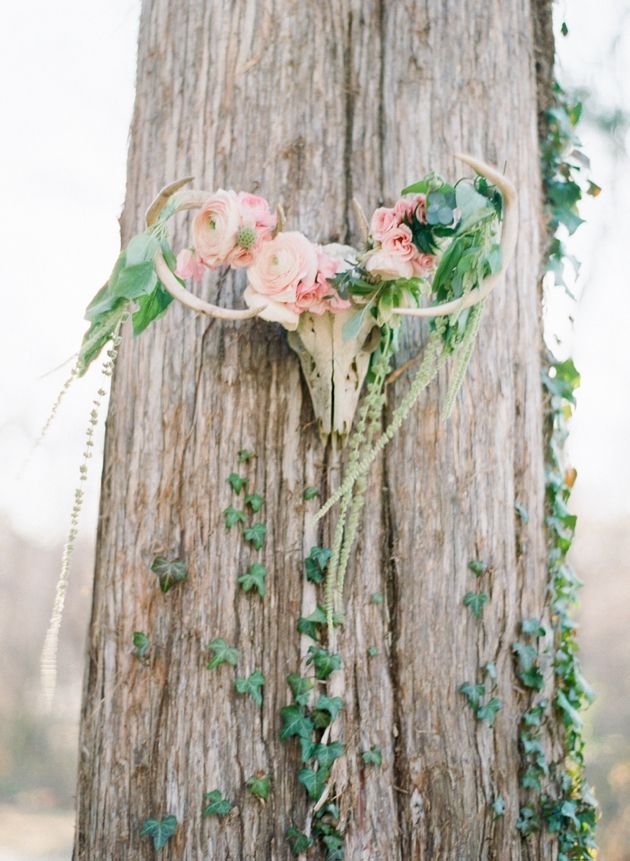 Antlers Adorned With Flowers- whimsical wedding decor idea