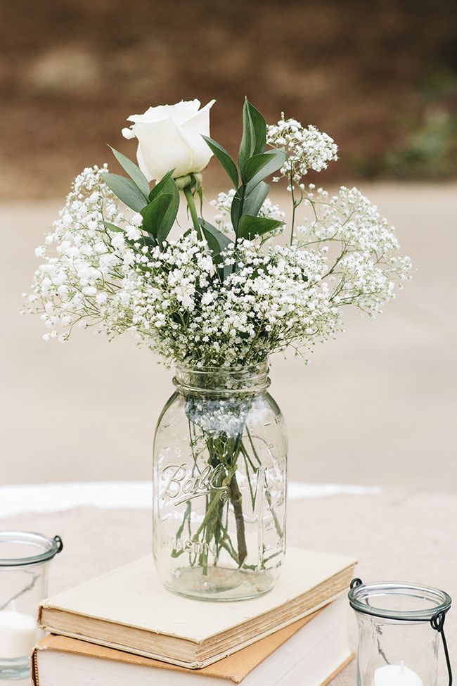 50+ Ways To Incorporate Mason Jars Into Your Wedding 20 Baby's breath and roses in a mason jar—a simple, affordable wedding centerpiece