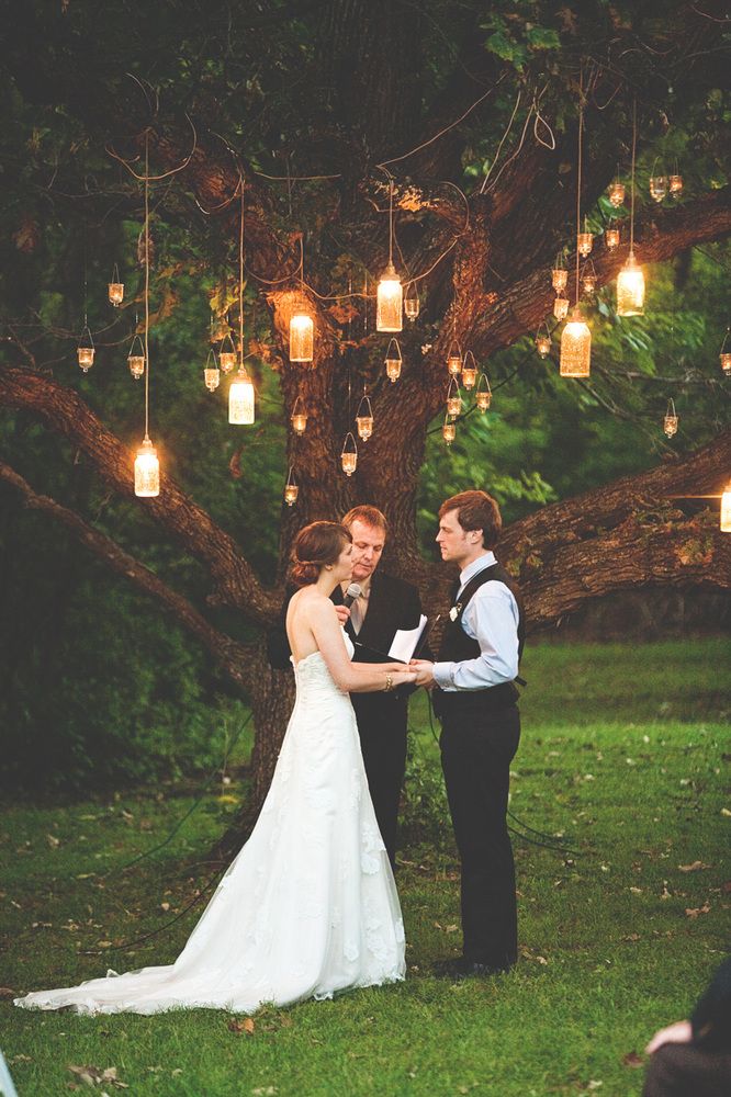 Candles hanging from the trees while you recite your vows