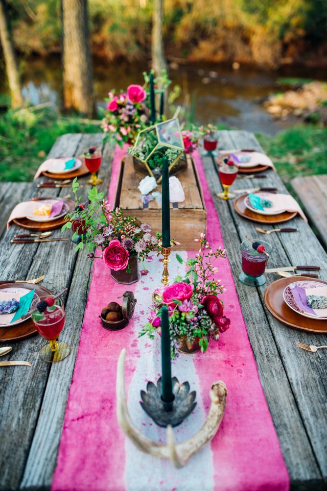 Colorful bohemian wedding tablescape with antler
