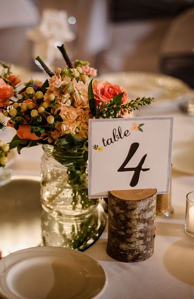 Cute rustic table number and floral centerpiece pairing