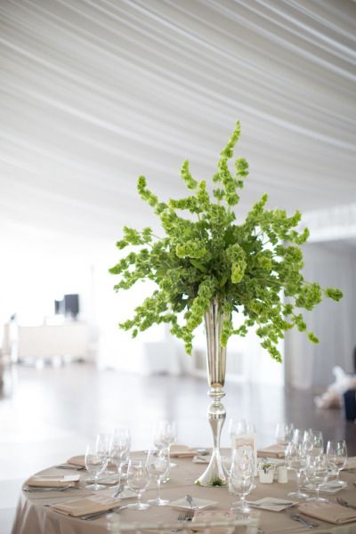 Elegant green floral tall wedding centerpiece