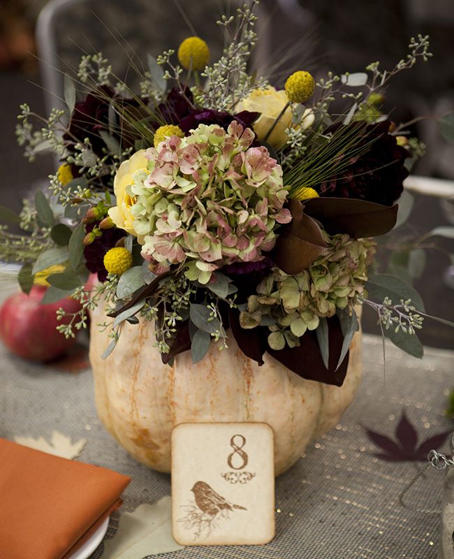 Fall wedding centerpieces with seasonal flowers and Fruits