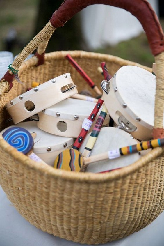 For a summer camp theme wedding fill a basket with small instruments for some fun campfire singing