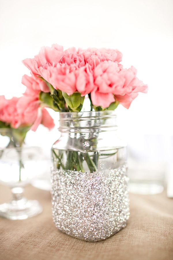 Glittered mason jars centerpiece with wedding reception flowers and floral arrangements