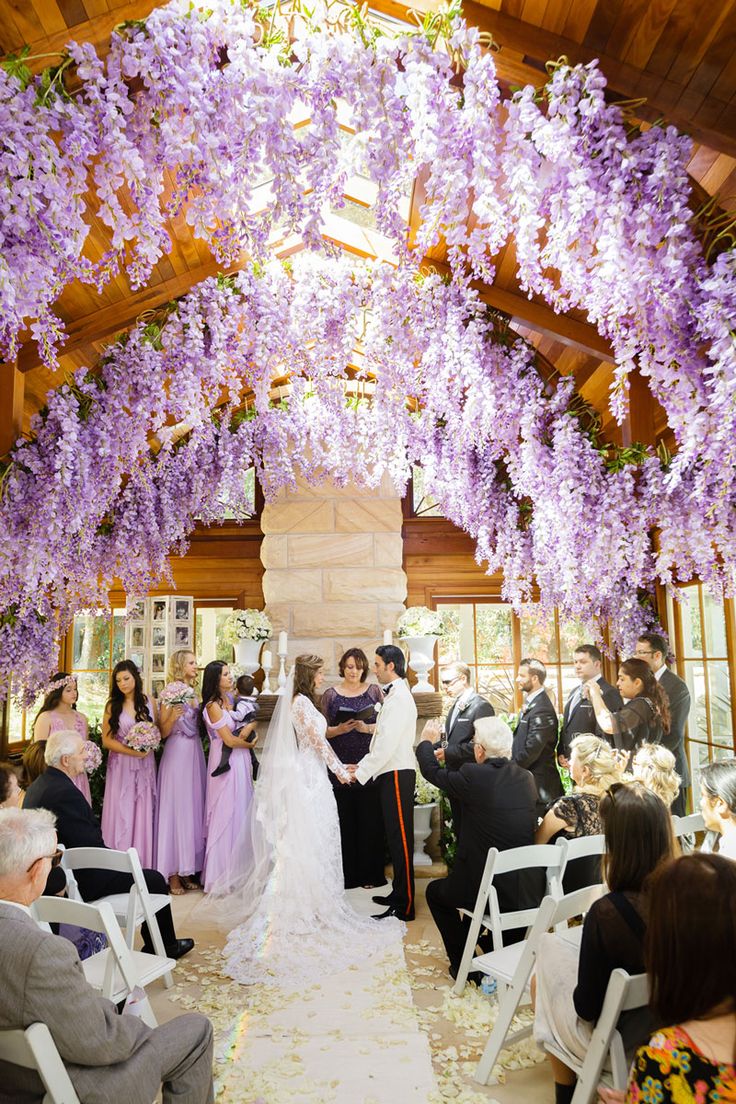 Hanging wisteria decorates romantic wedding reception