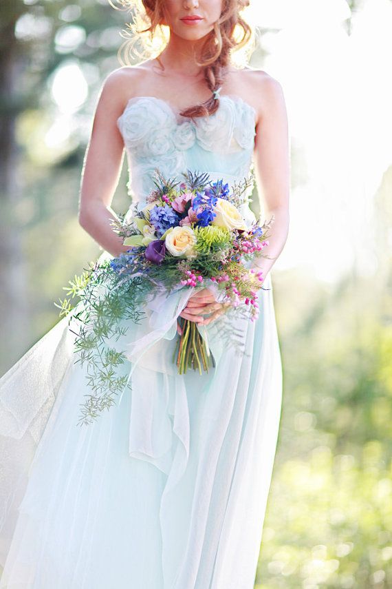 Light blue wedding dress with flower ruffles details