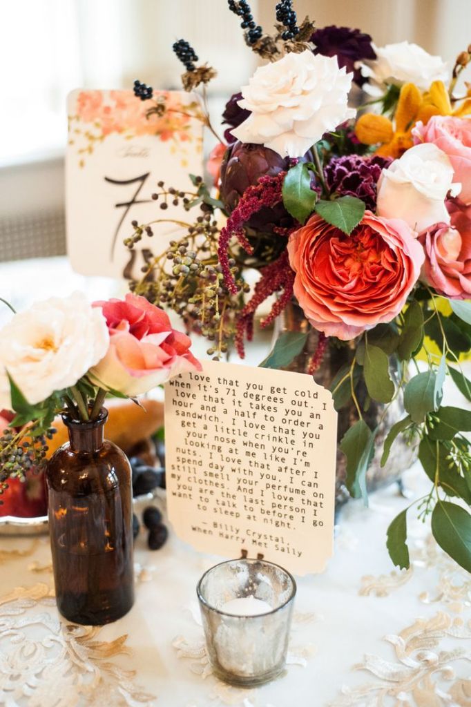Love quotes were scattered about on the tables at this wedding