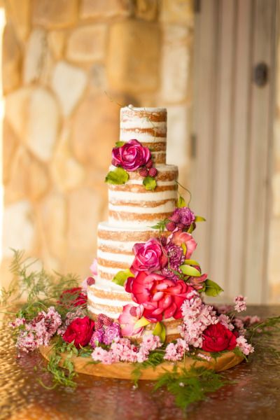 Naked wedding cake decorated with florals