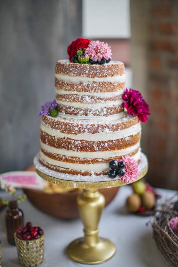Naked wedding cakes - Add a dusting of powdered sugar and adorn the cake with floral blooms
