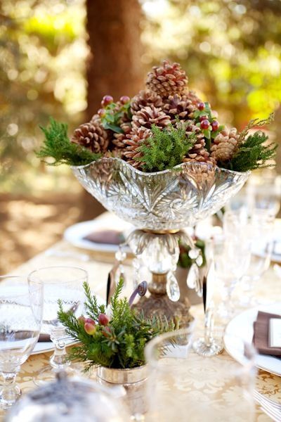 Pine Cones and short evergreen branches make an inexpensive fall or winter wedding centerpiece idea