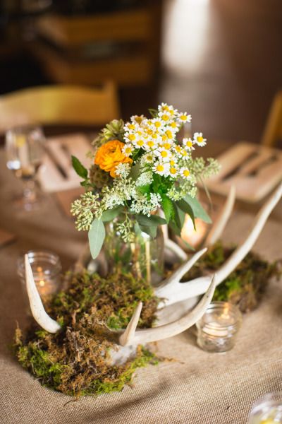 Ranunculus chamomile and seeded eucalyptus centerpieces