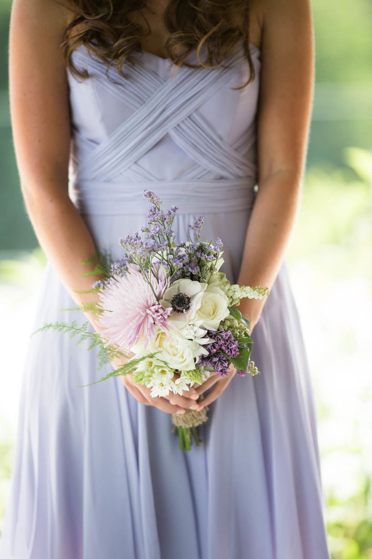 Soft purple wedding bouquet and lavender bridesmaid dress
