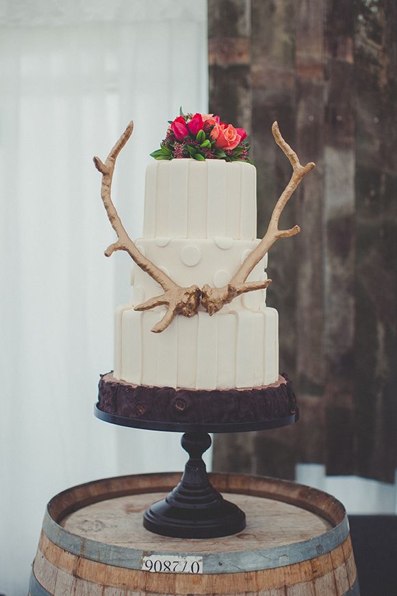 Wanaka Winter wedding cake with gold antler and flowers
