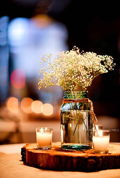 Wedding table center pieces with wood block and babies breath