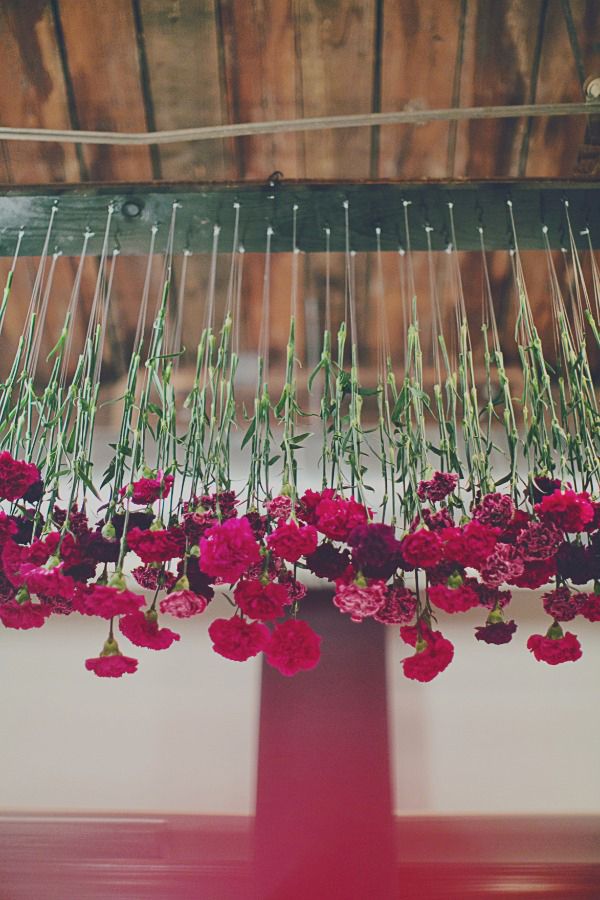 Whimsical deep red wedding floral decorations